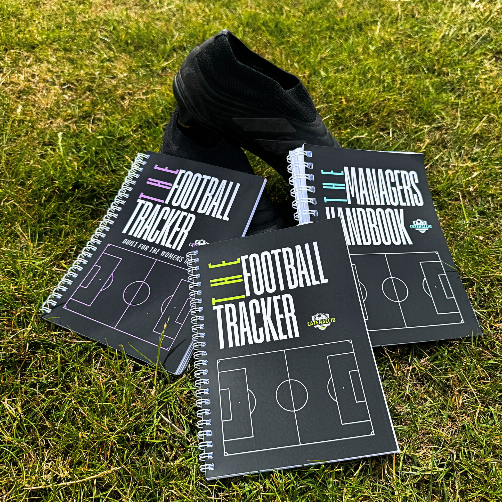 The football trackers and managers handbook on a pitch